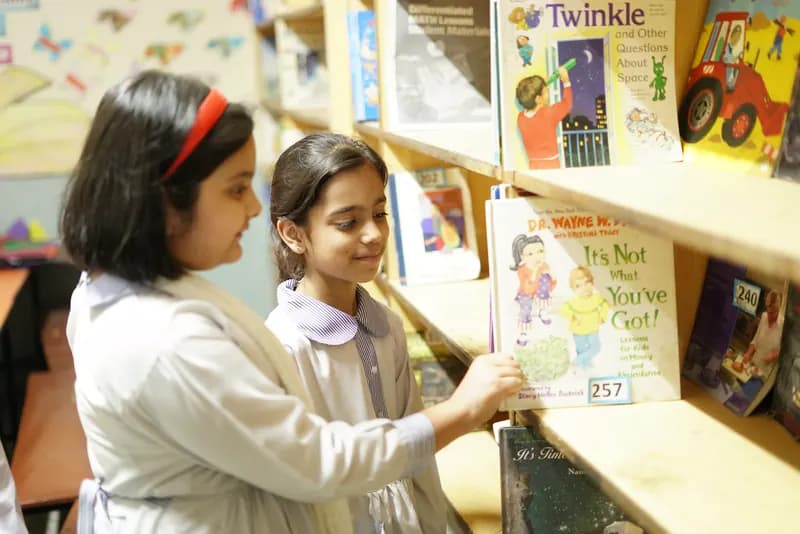 Farooqi Grammar School students reading together