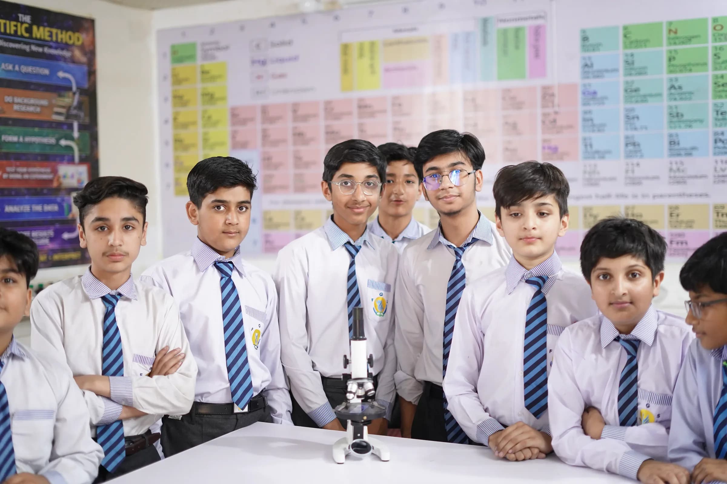 Farooqi Grammar School students gathered in a science setting